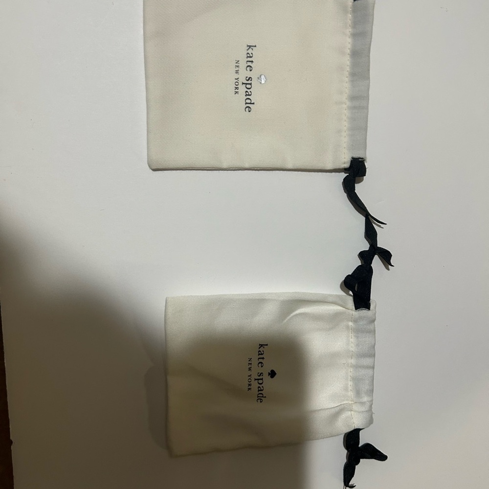 Kate Spade Cream Pouches with Black Drawstrings